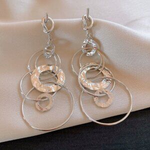 Silver needle geometric hollowed-out circular twisted pendant earrings